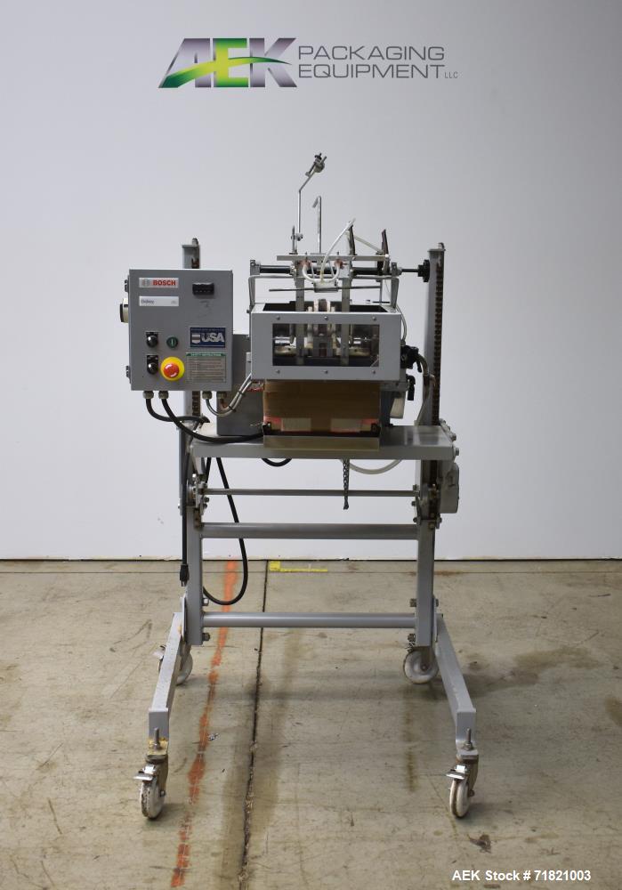 Used Bosch Doboy Semi-Automatic Bag Top Labeler, Model JSL.  Heat seals a paper header label to the top of a premade bag.  Speed Up to 30 bags / min.  Label width; 2.5" - 9.5" (6.35 - 24.13 cm), Unfo...