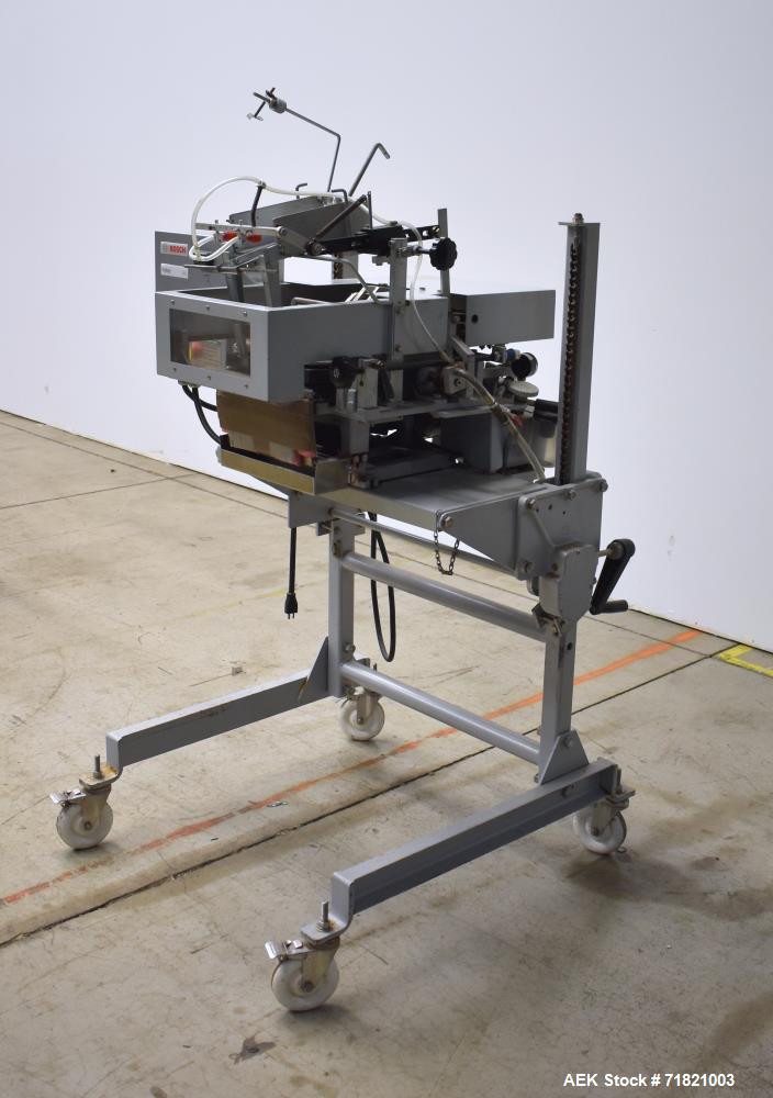 Used Bosch Doboy Semi-Automatic Bag Top Labeler, Model JSL.  Heat seals a paper header label to the top of a premade bag.  Speed Up to 30 bags / min.  Label width; 2.5" - 9.5" (6.35 - 24.13 cm), Unfo...