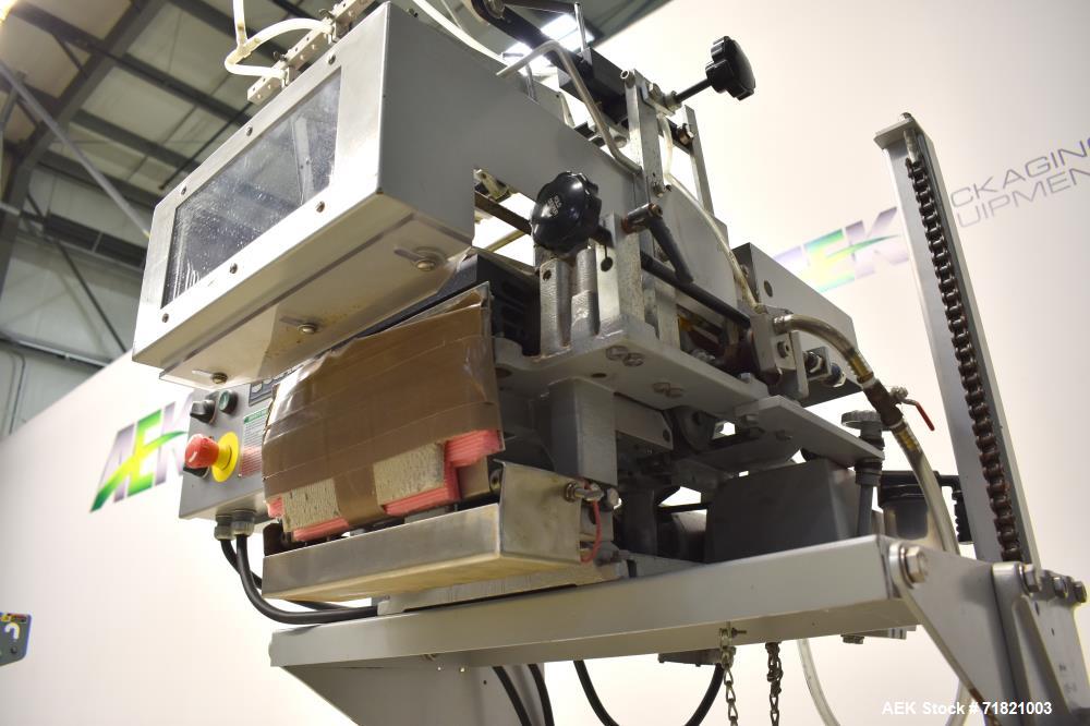 Used Bosch Doboy Semi-Automatic Bag Top Labeler, Model JSL.  Heat seals a paper header label to the top of a premade bag.  Speed Up to 30 bags / min.  Label width; 2.5" - 9.5" (6.35 - 24.13 cm), Unfo...