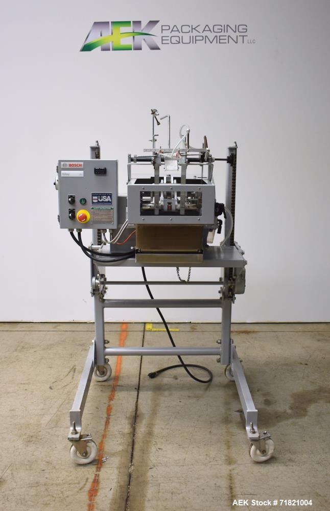Used Bosch Doboy Semi-Automatic Bag Top Labeler, Model JSL.  Heat seals a paper header label to the top of a premade bag.  Speed Up to 30 bags / min.  Label width; 2.5" - 9.5" (6.35 - 24.13 cm), Unfo...