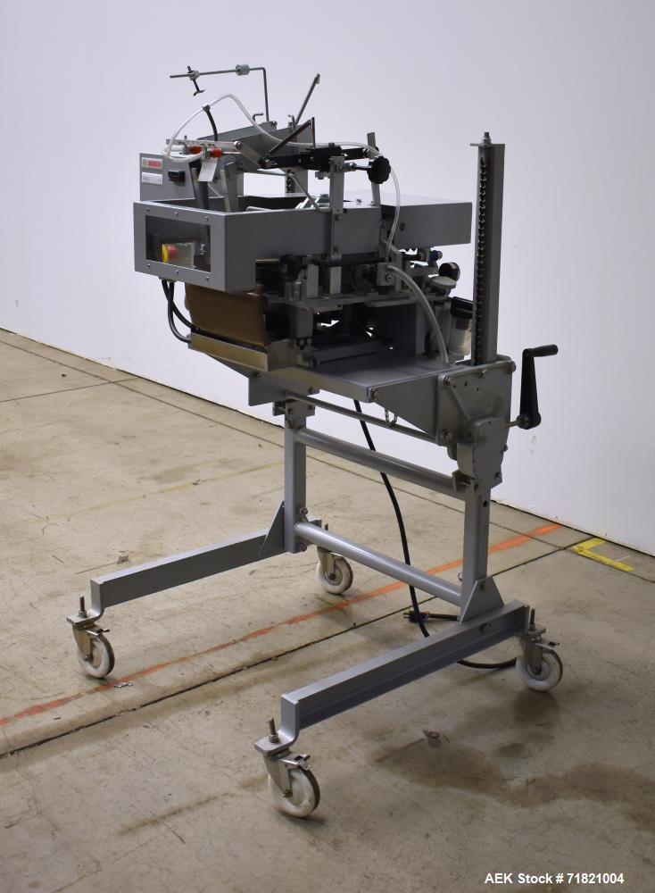 Used Bosch Doboy Semi-Automatic Bag Top Labeler, Model JSL.  Heat seals a paper header label to the top of a premade bag.  Speed Up to 30 bags / min.  Label width; 2.5" - 9.5" (6.35 - 24.13 cm), Unfo...