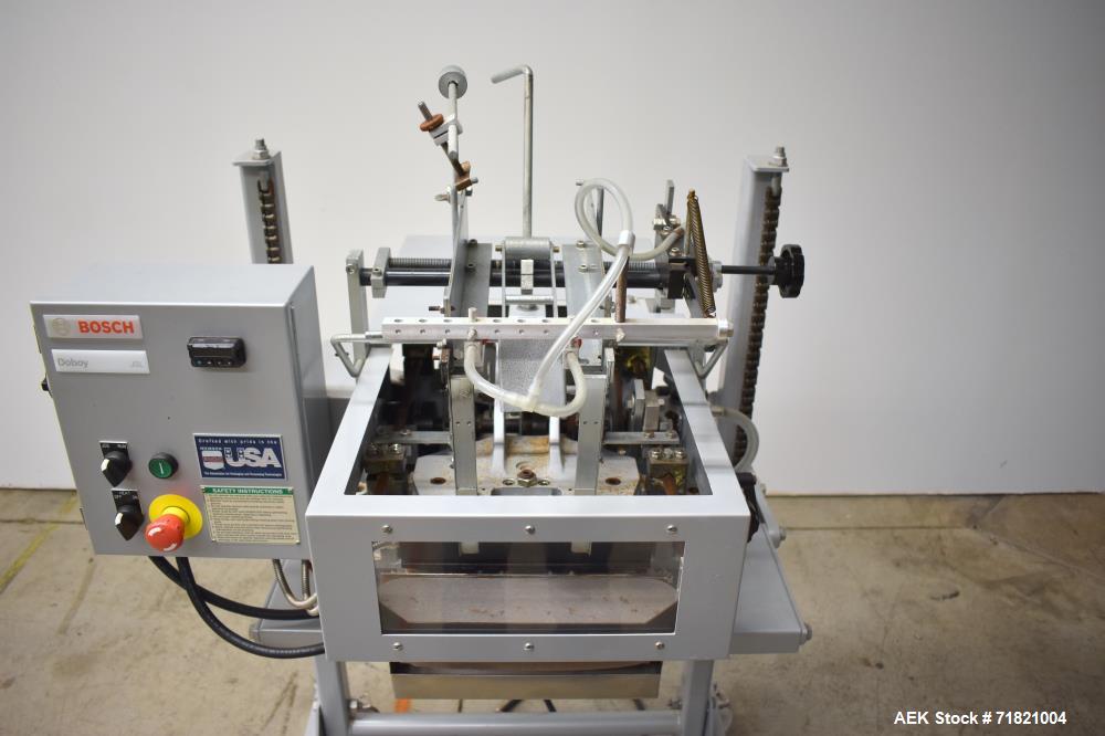 Used Bosch Doboy Semi-Automatic Bag Top Labeler, Model JSL.  Heat seals a paper header label to the top of a premade bag.  Speed Up to 30 bags / min.  Label width; 2.5" - 9.5" (6.35 - 24.13 cm), Unfo...