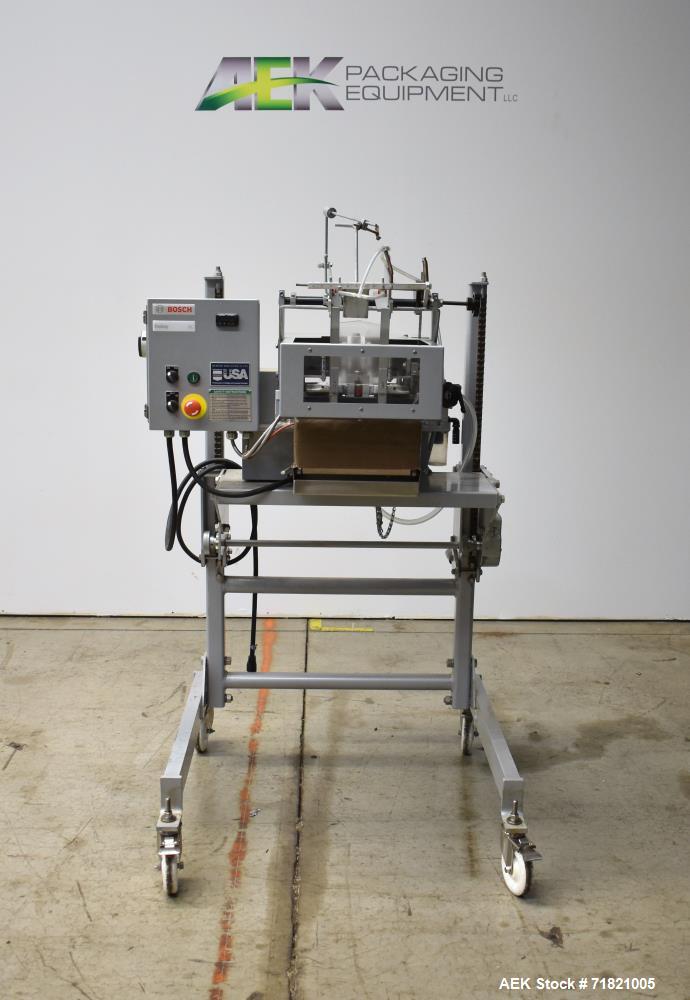 Used Bosch Doboy Semi-Automatic Bag Top Labeler, Model JSL.  Heat seals a paper header label to the top of a premade bag.  Speed Up to 30 bags / min.  Label width; 2.5" - 9.5" (6.35 - 24.13 cm), Unfo...