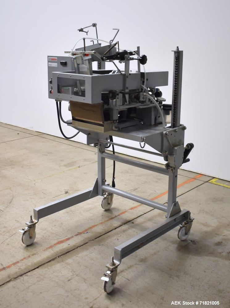 Used Bosch Doboy Semi-Automatic Bag Top Labeler, Model JSL.  Heat seals a paper header label to the top of a premade bag.  Speed Up to 30 bags / min.  Label width; 2.5" - 9.5" (6.35 - 24.13 cm), Unfo...
