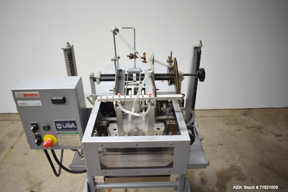 Used Bosch Doboy Semi-Automatic Bag Top Labeler, Model JSL.  Heat seals a paper header label to the top of a premade bag.  Speed Up to 30 bags / min.  Label width; 2.5" - 9.5" (6.35 - 24.13 cm), Unfo...