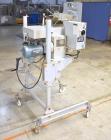 Used Bosch Doboy Semi-Automatic Bag Top Labeler, Model JSL.  Heat seals a paper header label to the top of a premade bag.  Speed up to 30 bags / minute.  Label Width: 2.5