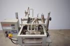 Used Bosch Doboy Semi-Automatic Bag Top Labeler, Model JSL.  Heat seals a paper header label to the top of a premade bag.  Speed up to 30 bags / minute.  Label Width: 2.5