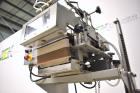 Used Bosch Doboy Semi-Automatic Bag Top Labeler, Model JSL.  Heat seals a paper header label to the top of a premade bag.  Speed up to 30 bags / minute.  Label Width: 2.5