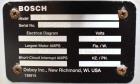 Used Bosch Doboy Semi-Automatic Bag Top Labeler, Model JSL.  Heat seals a paper header label to the top of a premade bag.  Speed up to 30 bags / minute.  Label Width: 2.5