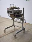 Used Bosch Doboy Semi-Automatic Bag Top Labeler, Model JSL.  Heat seals a paper header label to the top of a premade bag.  Speed Up to 30 bags / min.  Label width; 2.5