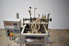 Used Bosch Doboy Semi-Automatic Bag Top Labeler, Model JSL.  Heat seals a paper header label to the top of a premade bag.  Speed Up to 30 bags / min.  Label width; 2.5