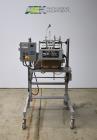 Used Bosch Doboy Semi-Automatic Bag Top Labeler, Model JSL.  Heat seals a paper header label to the top of a premade bag.  Speed Up to 30 bags / min.  Label width; 2.5
