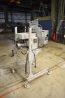Used Bosch Doboy Semi-Automatic Bag Top Labeler, Model JSL.  Heat seals a paper header label to the top of a premade bag.  Speed Up to 30 bags / min.  Label width; 2.5
