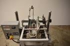Used Bosch Doboy Semi-Automatic Bag Top Labeler, Model JSL.  Heat seals a paper header label to the top of a premade bag.  Speed Up to 30 bags / min.  Label width; 2.5