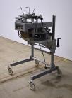 Used Bosch Doboy Semi-Automatic Bag Top Labeler, Model JSL.  Heat seals a paper header label to the top of a premade bag.  Speed Up to 30 bags / min.  Label width; 2.5
