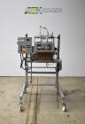 Used Bosch Doboy Semi-Automatic Bag Top Labeler, Model JSL.  Heat seals a paper header label to the top of a premade bag.  Speed Up to 30 bags / min.  Label width; 2.5