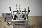 Used Bosch Doboy Semi-Automatic Bag Top Labeler, Model JSL.  Heat seals a paper header label to the top of a premade bag.  Speed Up to 30 bags / min.  Label width; 2.5