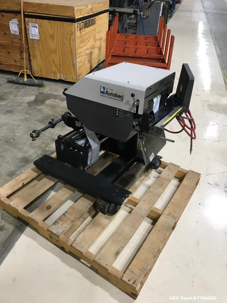 Used Automated Packaging Systems Autobag Model AB 180 Bagger. Capable of up to 80 bags per minute. Has bag size range of 2" to 11" Wide X 3" to 22" Long, bag thickness of 1.0 to 4.0 mil, and Pass-thr...