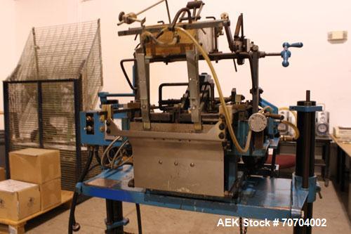Used Doboy Bag Top Labeler, Model JSL.  Seals, folds and labels up to 40 bags per minute.  Seal width 1/2" (3.81 cm).  Label width 2.5" - 9.5" (6.35 cm - 24.13 cm).  Unfolded label height 1.25" to 6....