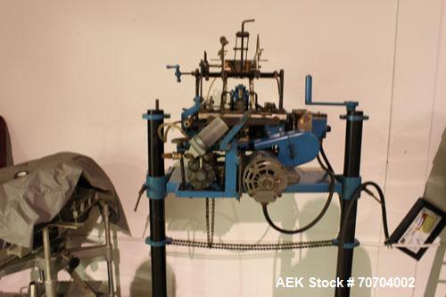 Used Doboy Bag Top Labeler, Model JSL.  Seals, folds and labels up to 40 bags per minute.  Seal width 1/2" (3.81 cm).  Label width 2.5" - 9.5" (6.35 cm - 24.13 cm).  Unfolded label height 1.25" to 6....