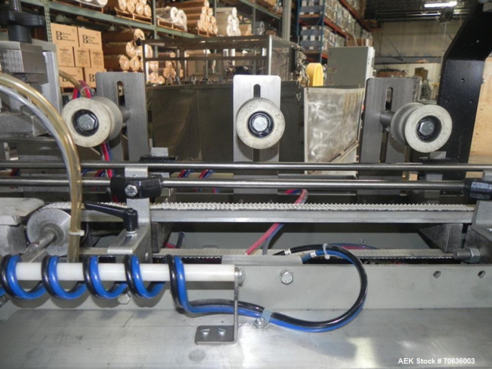 Used Rennco Dual 501 Vertical L-Bar Sealer with model CCL (cup counter loader). Horizontal seal approximately 36" wide, vertical seal is approximately 22" long. Has scrap removal and dual cleated 24"...