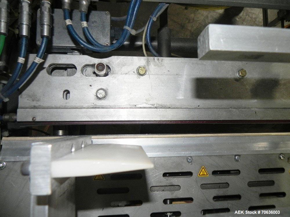 Used Rennco Dual 501 Vertical L-Bar Sealer with model CCL (cup counter loader). Horizontal seal approximately 36" wide, vertical seal is approximately 22" long. Has scrap removal and dual cleated 24"...