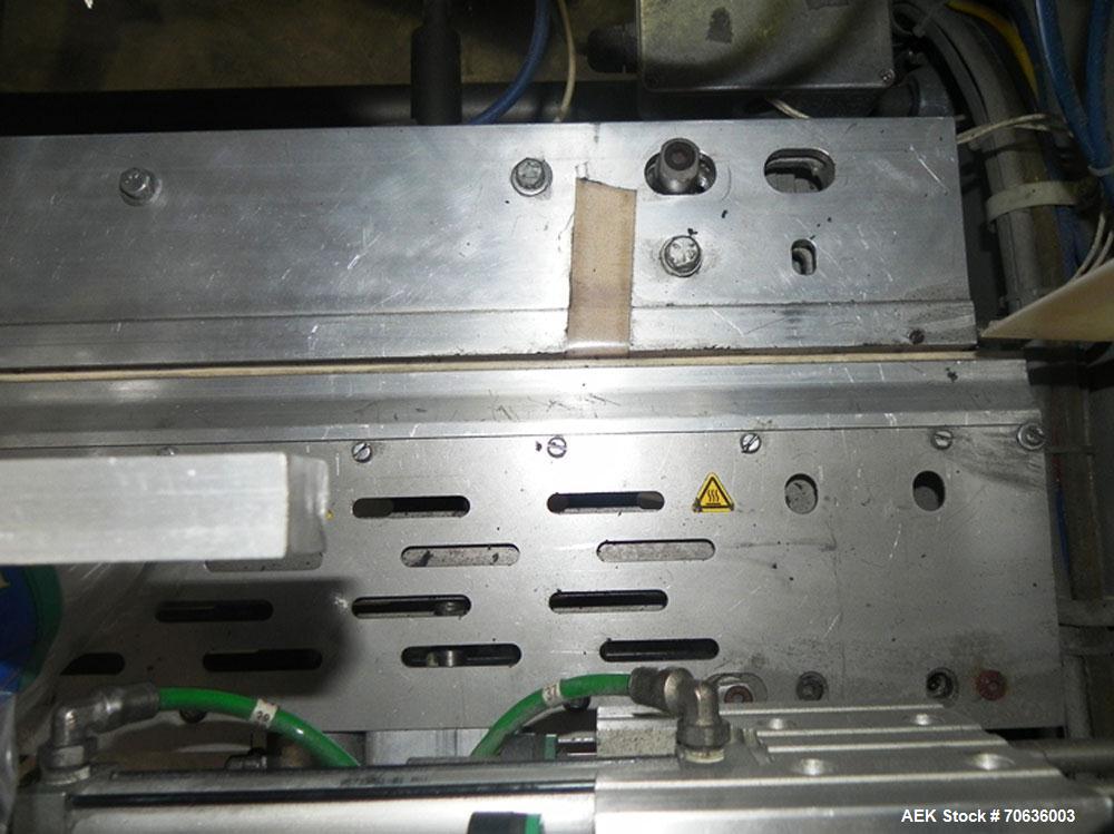 Used Rennco Dual 501 Vertical L-Bar Sealer with model CCL (cup counter loader). Horizontal seal approximately 36" wide, vertical seal is approximately 22" long. Has scrap removal and dual cleated 24"...