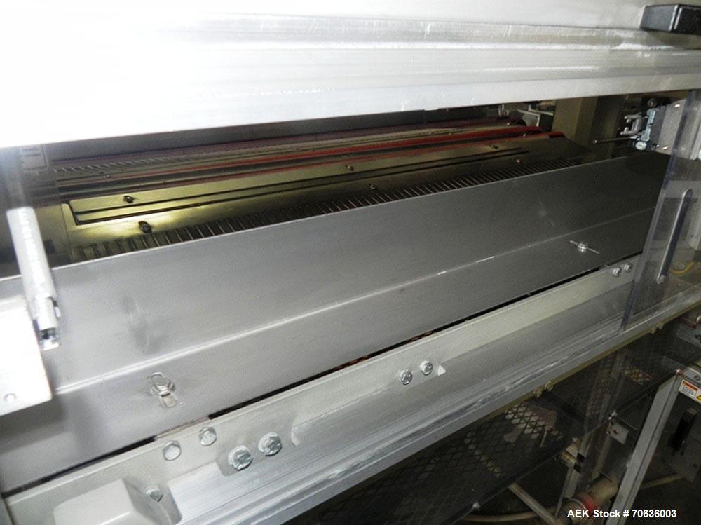 Used Rennco Dual 501 Vertical L-Bar Sealer with model CCL (cup counter loader). Horizontal seal approximately 36" wide, vertical seal is approximately 22" long. Has scrap removal and dual cleated 24"...