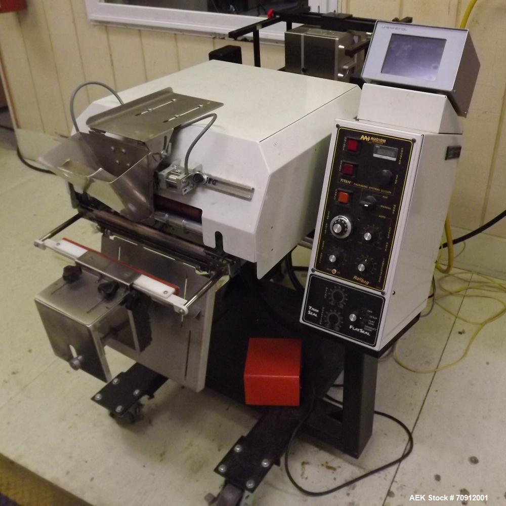 Used Titan Automatic Bagger and Sealer, Model 6500 Rollbag.  Min bag size 2" x 2", max bag size 10" x 12", 60 bags/min, fully automatic, high speed bag opening, loading and sealing, jaw activation, h...