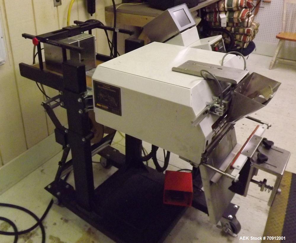Used Titan Automatic Bagger and Sealer, Model 6500 Rollbag.  Min bag size 2" x 2", max bag size 10" x 12", 60 bags/min, fully automatic, high speed bag opening, loading and sealing, jaw activation, h...