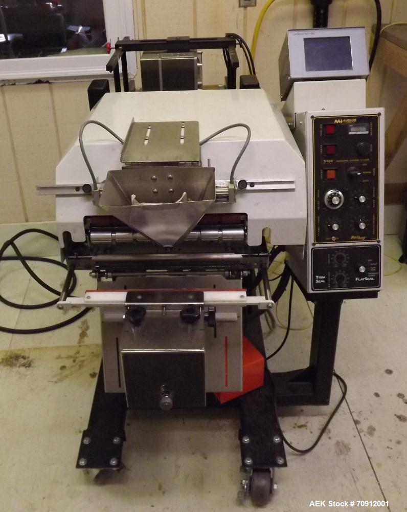 Used Titan Automatic Bagger and Sealer, Model 6500 Rollbag.  Min bag size 2" x 2", max bag size 10" x 12", 60 bags/min, fully automatic, high speed bag opening, loading and sealing, jaw activation, h...