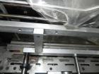 Used Rennco Dual 501 Vertical L-Bar Sealer with model CCL (cup counter loader). Horizontal seal approximately 36