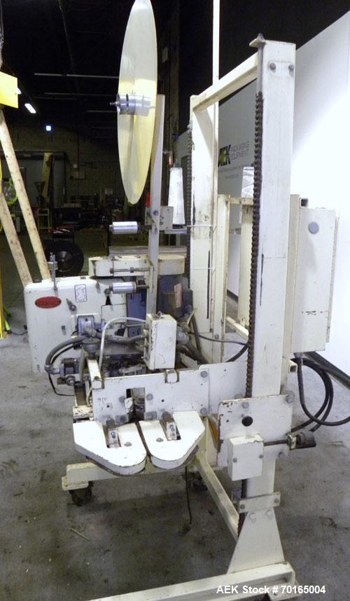 Used Doboy Model D-95A HD Bag Sewing System. Trims top of bag, folds tape over top of bag and stitches bags up to 50 linear feet per minute, can do a 1 or 2 thread stitch, and has a variable speed dr...