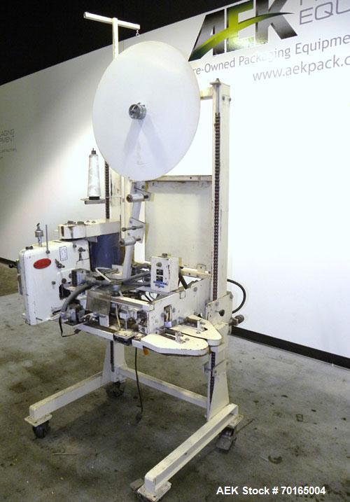 Used Doboy Model D-95A HD Bag Sewing System. Trims top of bag, folds tape over top of bag and stitches bags up to 50 linear feet per minute, can do a 1 or 2 thread stitch, and has a variable speed dr...