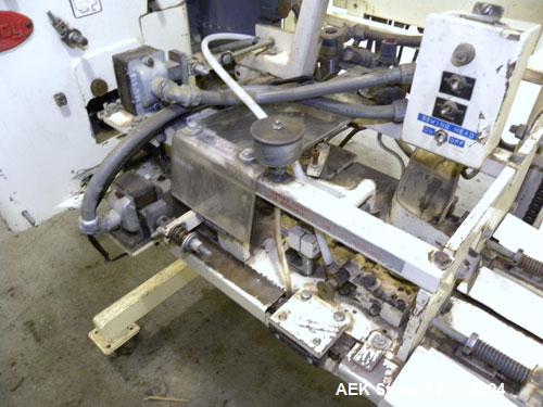 Used Doboy Model D-95A HD Bag Sewing System. Trims top of bag, folds tape over top of bag and stitches bags up to 50 linear feet per minute, can do a 1 or 2 thread stitch, and has a variable speed dr...