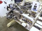 Used Doboy Model D-95A HD Bag Sewing System. Trims top of bag, folds tape over top of bag and stitches bags up to 50 linear feet per minute, can do a 1 or 2 thread stitch, and has a variable speed dr...