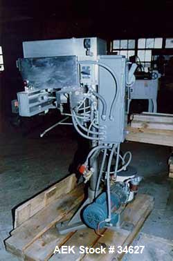 Used Container Corp of America Snorcca jaw type heat sealer.Container vacuum packaging system, 32" wide air operated sealing jaws. 0-600 deg F thermostat. Air operated top tamper vacuum pump directdr...
