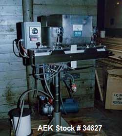 Used Container Corp of America Snorcca jaw type heat sealer.Container vacuum packaging system, 32" wide air operated sealing jaws. 0-600 deg F thermostat. Air operated top tamper vacuum pump directdr...