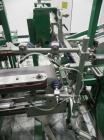 Used K&R Equipment Model PBI-AT 32 Case Erector and Bag Inserter. Capable of speeds up to 12 cases per minute. Has a case size range: 12