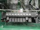Used K&R Equipment Model PBI-AT 32 Case Erector and Bag Inserter. Capable of speeds up to 12 cases per minute. Has a case size range: 12