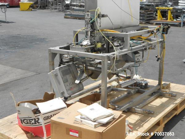 Used LiquiBox (DuPont) BIB Filler. Strip fed bag filler with OxEvac system is designed to fill one to five gallon bags used in the wine, juice, beverage and other oxygen sensitive products. A carton ...