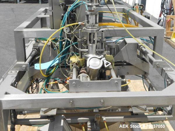 Used LiquiBox (DuPont) BIB Filler. Strip fed bag filler with OxEvac system is designed to fill one to five gallon bags used in the wine, juice, beverage and other oxygen sensitive products. A carton ...