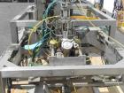 Used LiquiBox (DuPont) BIB Filler. Strip fed bag filler with OxEvac system is designed to fill one to five gallon bags used in the wine, juice, beverage and other oxygen sensitive products. A carton ...
