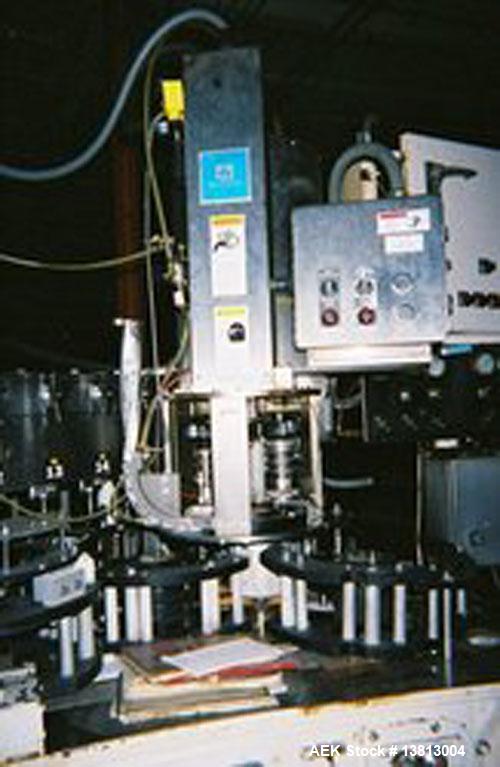 Used Crown 45 Valve Filler, Model 45-6. With 6 head cap-in-head capper. 3.0L pitch machine. Includes Alcoa 6 head capper converted to cap-in-head for 28 mm flat caps. Includes cap sorter. Change part...