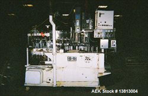 Used Crown 45 Valve Filler, Model 45-6. With 6 head cap-in-head capper. 3.0L pitch machine. Includes Alcoa 6 head capper converted to cap-in-head for 28 mm flat caps. Includes cap sorter. Change part...