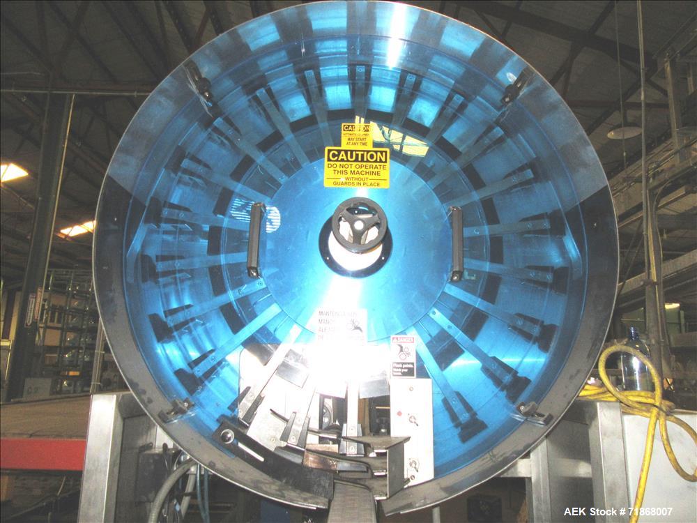 Used McBrady Orbital Bottle Air Cleaner / Rinser, mn 200, sn A48-21238 with control panel, capable of 200 bottles per minute max speed, 4 1/2" table top plastic feed conveyor approx 20' long L-shape ...