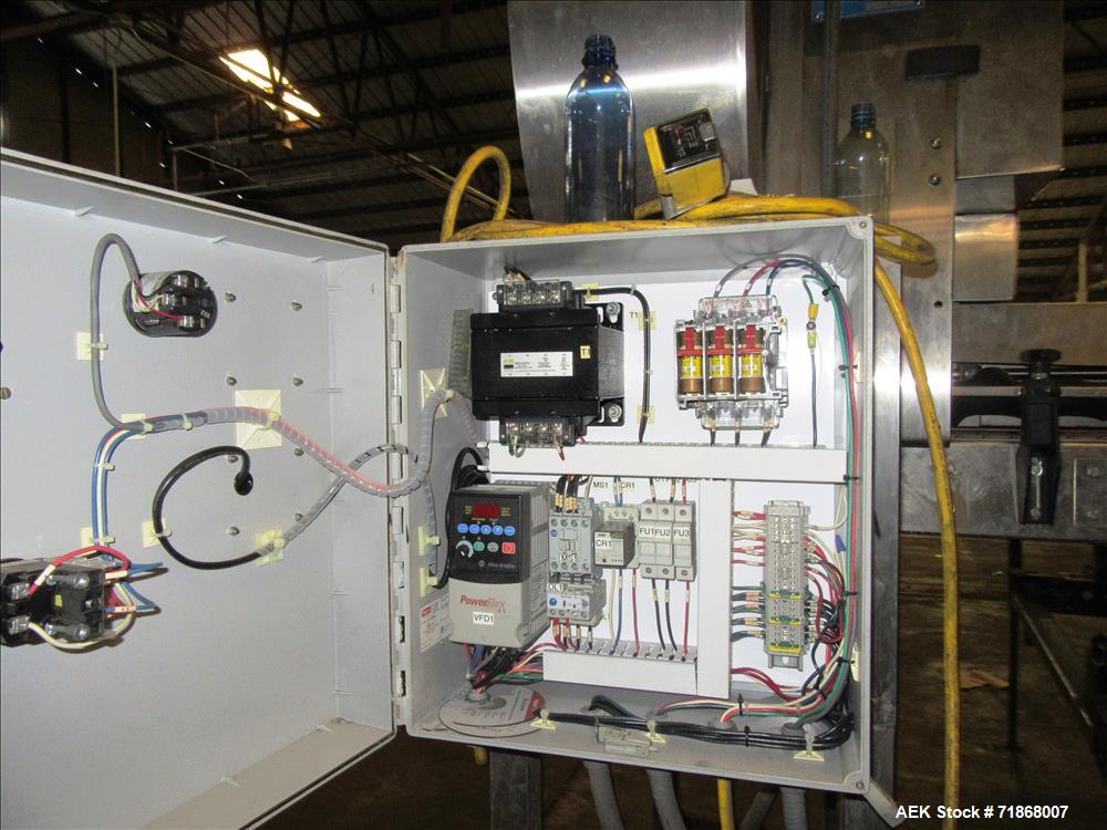 Used McBrady Orbital Bottle Air Cleaner / Rinser, mn 200, sn A48-21238 with control panel, capable of 200 bottles per minute max speed, 4 1/2" table top plastic feed conveyor approx 20' long L-shape ...
