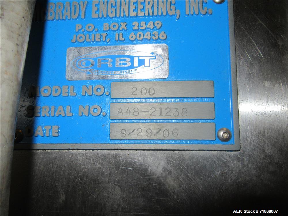 Used McBrady Orbital Bottle Air Cleaner / Rinser, mn 200, sn A48-21238 with control panel, capable of 200 bottles per minute max speed, 4 1/2" table top plastic feed conveyor approx 20' long L-shape ...