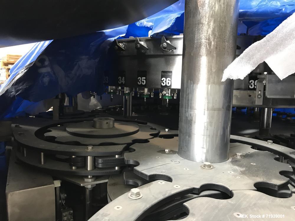 Used Bevcorp Crown Uni-Blend 45-12 Valve Bottle Filler. Speed 12 oz up to 400 bpm. 460 V, 60 Hz, 3 Phase. Glass explosion shields included. Reported to be reconditioned. Mfg. 2007