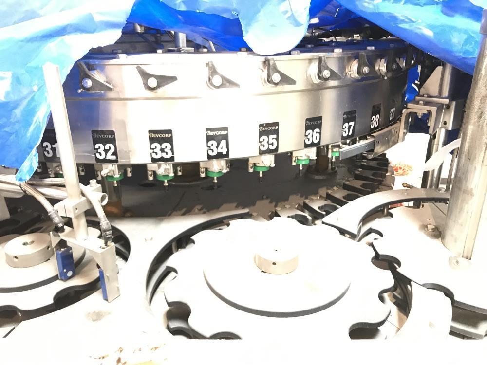 Used Bevcorp Crown Uni-Blend 45-12 Valve Bottle Filler. Speed 12 oz up to 400 bpm. 460 V, 60 Hz, 3 Phase. Glass explosion shields included. Reported to be reconditioned. Mfg. 2007
